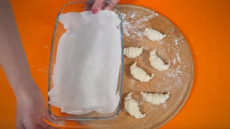 Cover the baking dish with parchment.