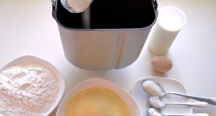 First, pour dry yeast into the bread bucket.