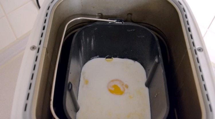 Set the bucket of ingredients in the bread machine.