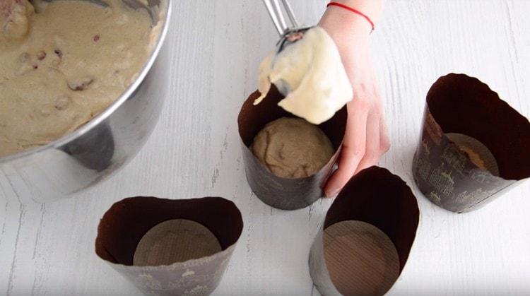 We spread the dough into forms.