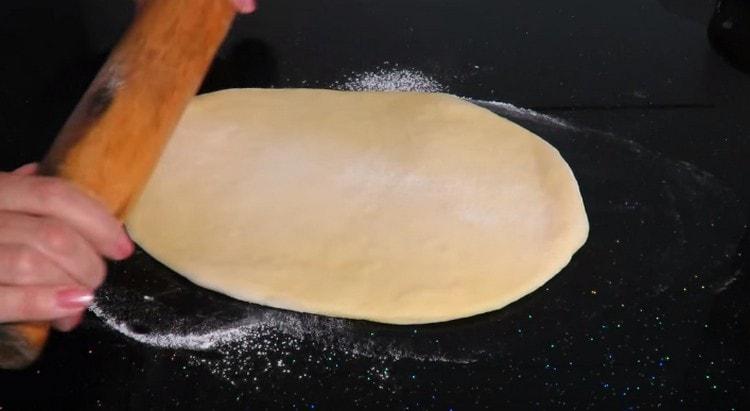 Roll each part of the dough thinly.