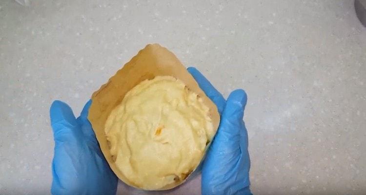 From the risen dough we form cakes and put it in the forms.