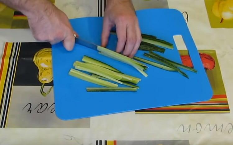 Fresh cucumber cut into thin strips.