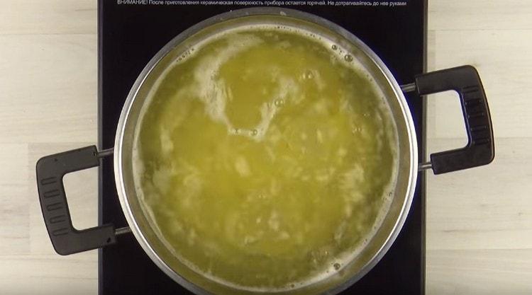 Cook pasta until cooked.