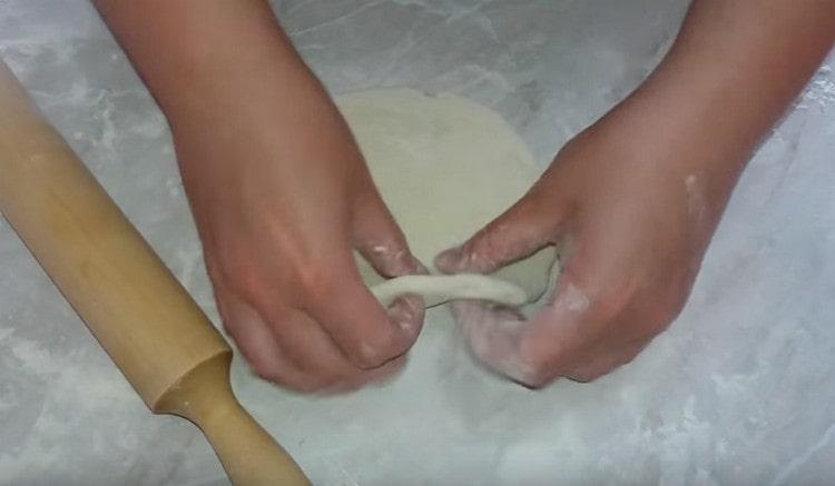 We roll each piece into a round cake.