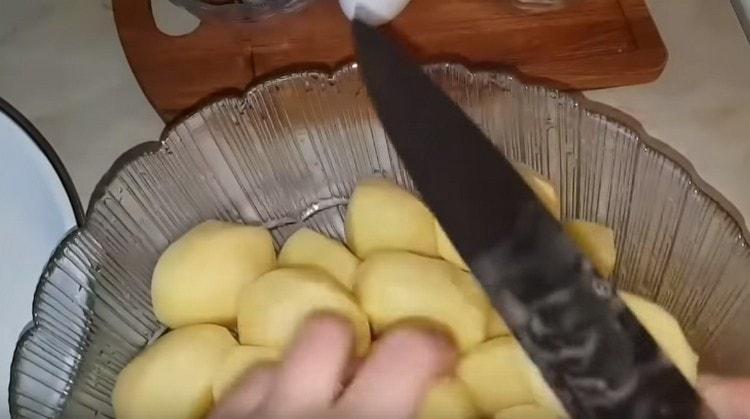 Peel the potatoes.