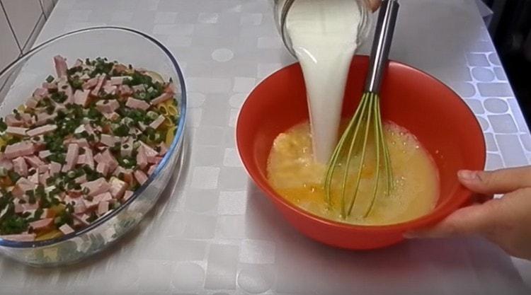 Add water and milk to the egg mass.