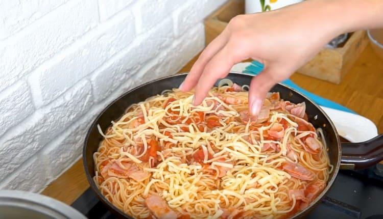 Sprinkle grated cheese over an almost finished dish.