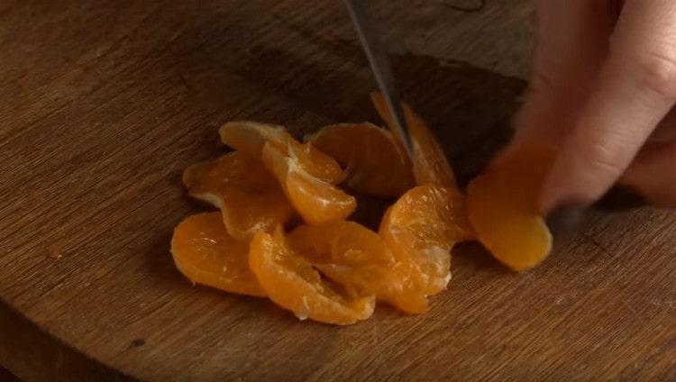 Tangerine slices cut in half.