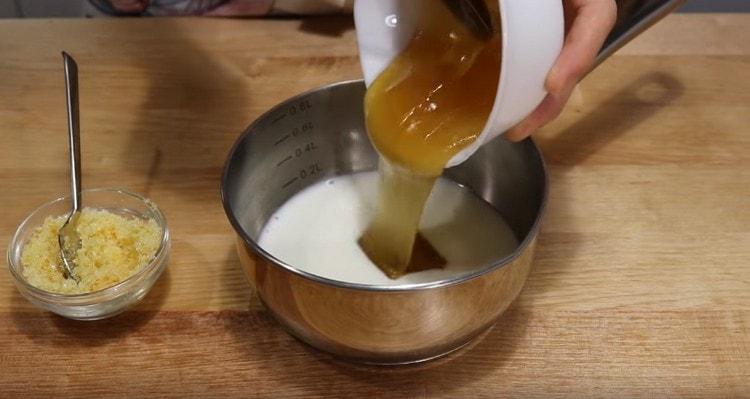Pour milk into the stewpan, add honey to it.