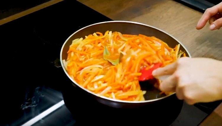 Add bay leaf to the vegetables.