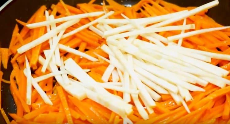 Add celery to the carrots in a skillet.