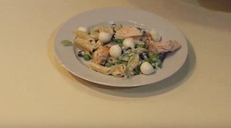 When served, mozzarella balls can be added to the dish.