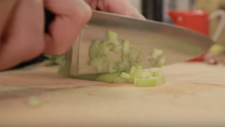 Finely chop the celery.