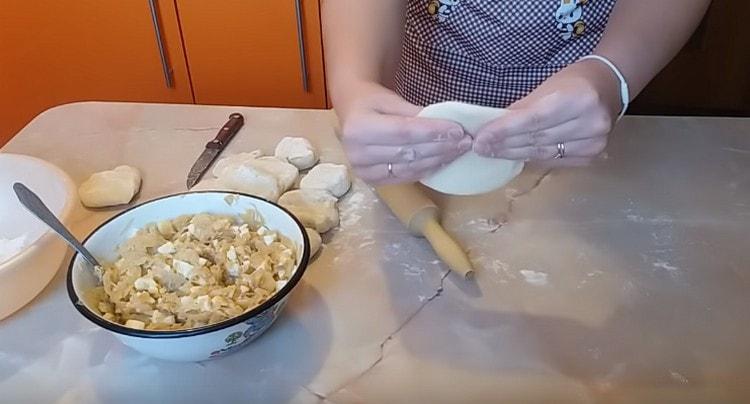 Roll out each piece of dough.