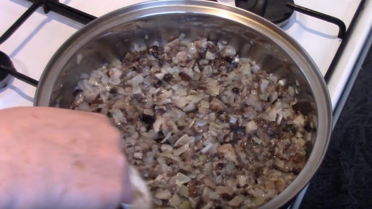 Add mushrooms to the onion and fry all together.