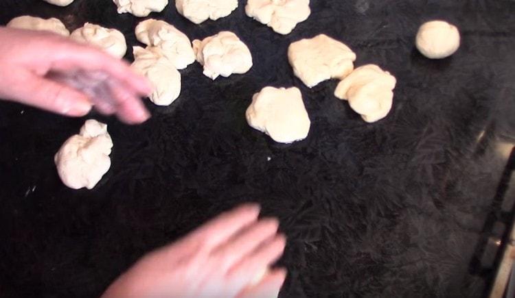 Roll out portioned balls from the dough.