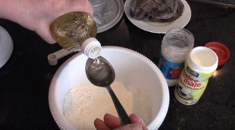 Add vegetable oil to the dry components.