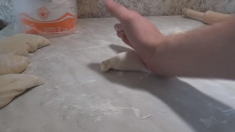 Hand divide the resulting roll into 4 parts.