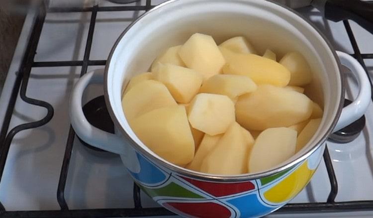 Peel and boil the potatoes until cooked.