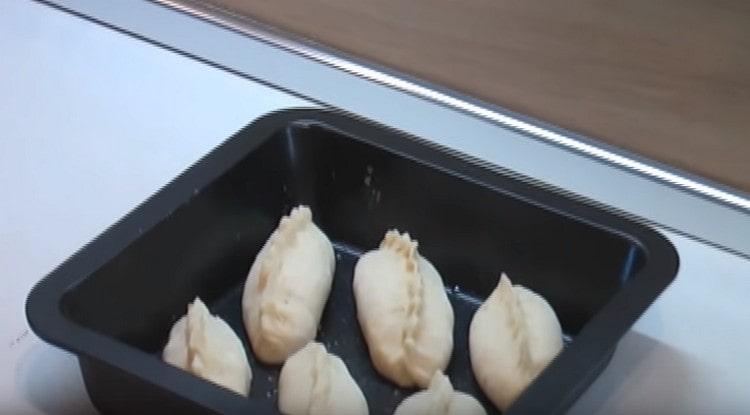 Put the pies on a baking sheet.