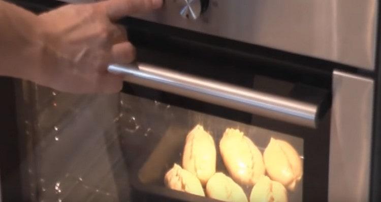 We put a baking tray with pies in the oven.