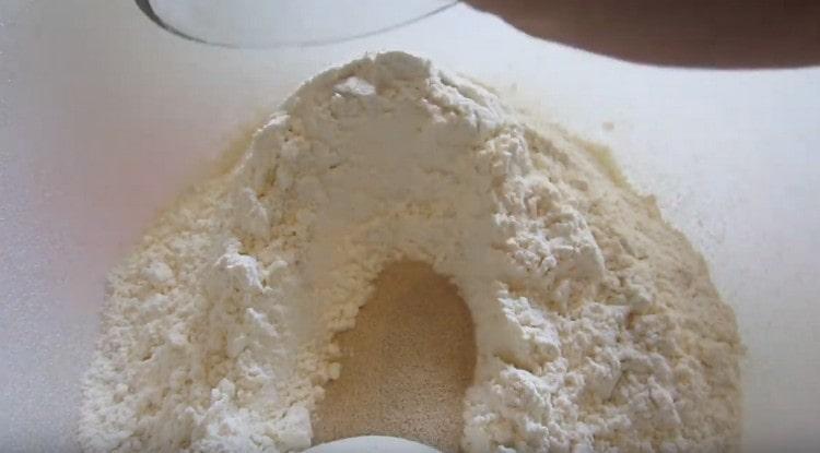 Add dry yeast to the flour.