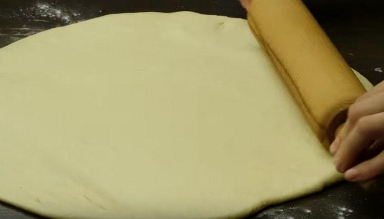 We roll out each piece with a rolling pin.
