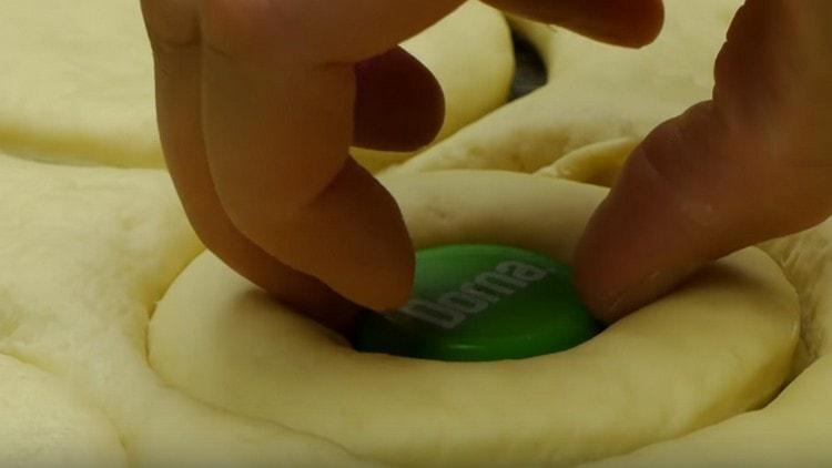 Squeeze a hole in each blank, forming donuts.