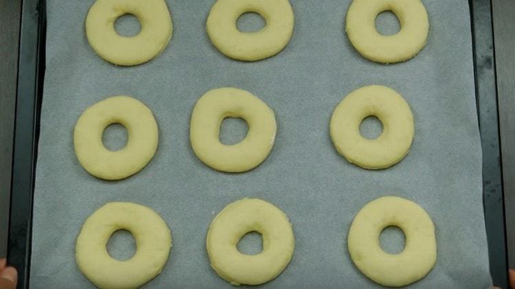 Put the donuts on a baking sheet.