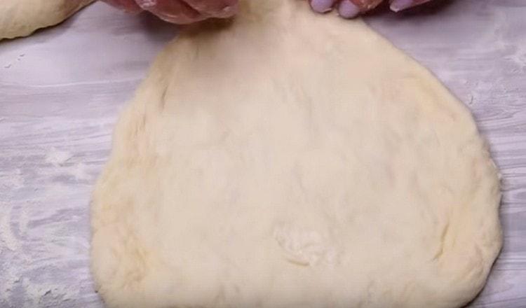 We stretch each blank with our hands, forming a cake.