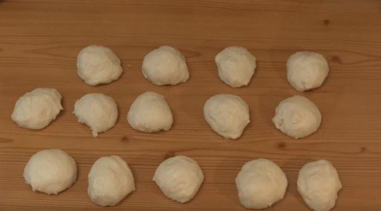 When the dough comes up, we form small balls out of it.