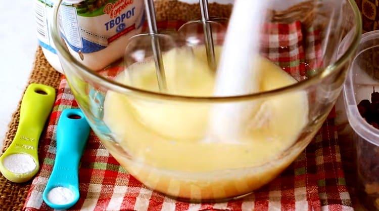 Add sugar and vanilla sugar to the eggs, whisk again.