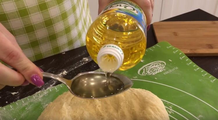 Add vegetable oil to the dough.