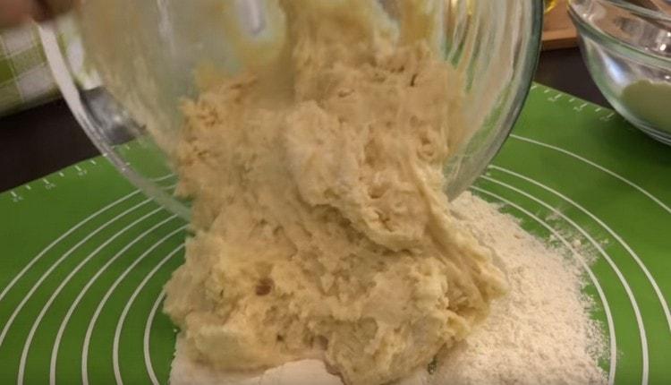 Knead the thickened dough on the table.