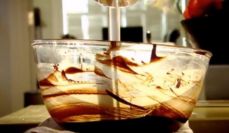 Add milk to the chocolate mass.