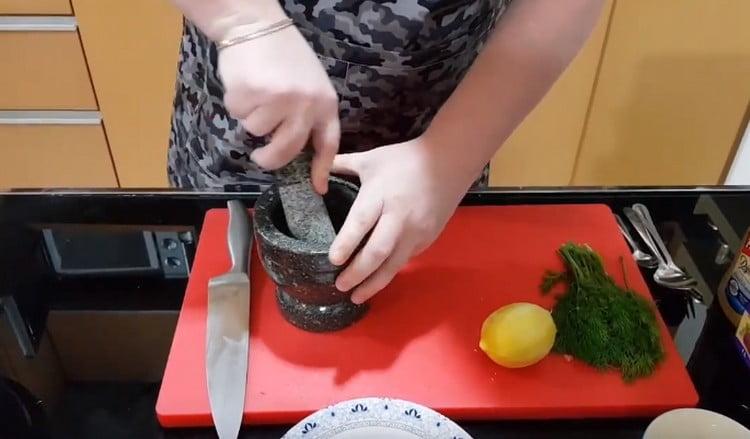 Grind the almonds in a mortar.