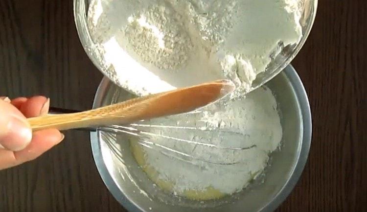 Gradually add flour to the liquid base.