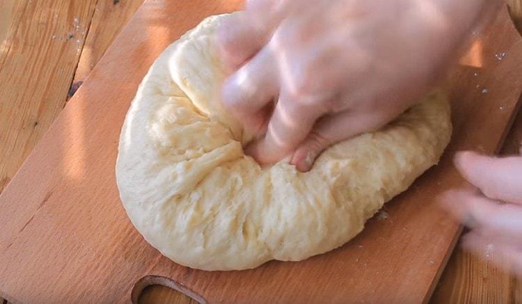 We collect the dough into a ball.