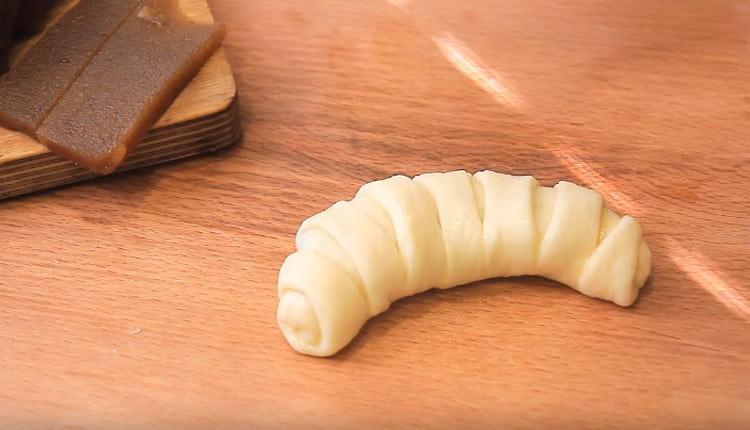 The bagel is slightly bent.