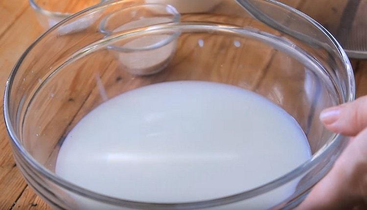 Pour warm milk into a bowl.