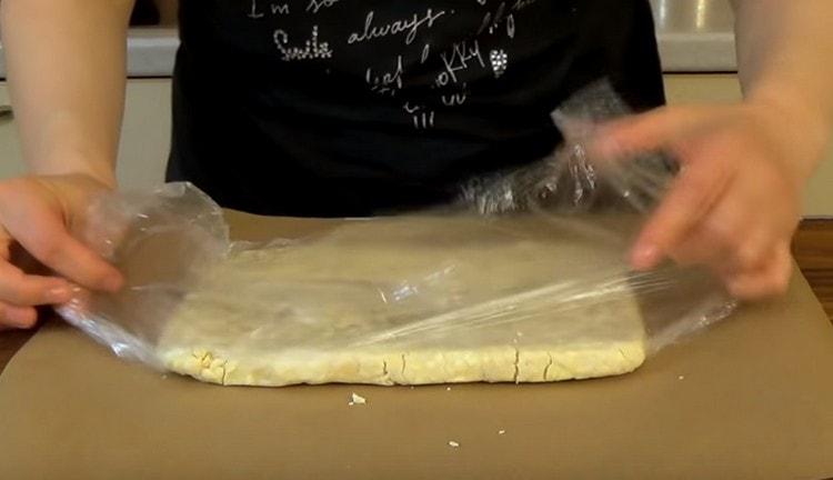 After the dough lies in the refrigerator, put it on a sheet of parchment.