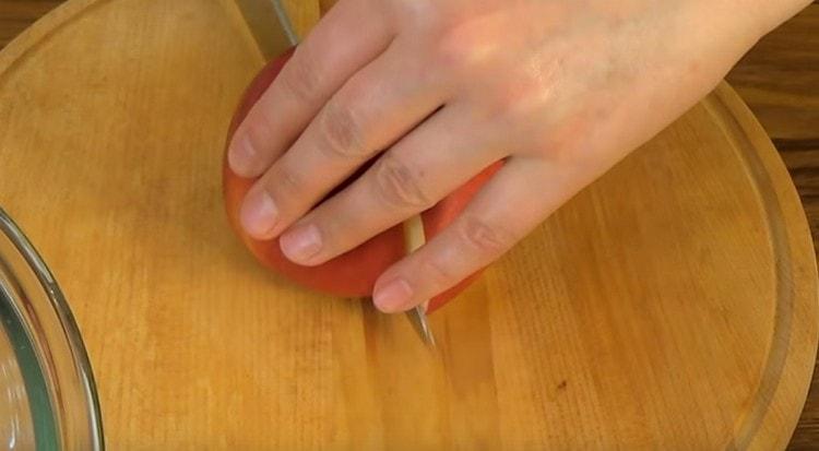 Cut the apple in half and remove the core.