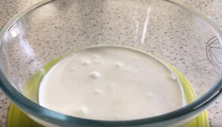 Dissolve yeast with sugar in warm cream.