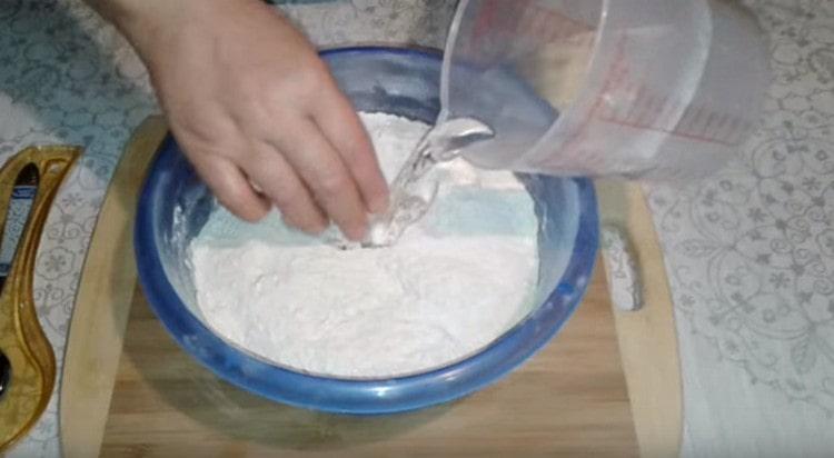 We introduce warm water into the flour mixture.
