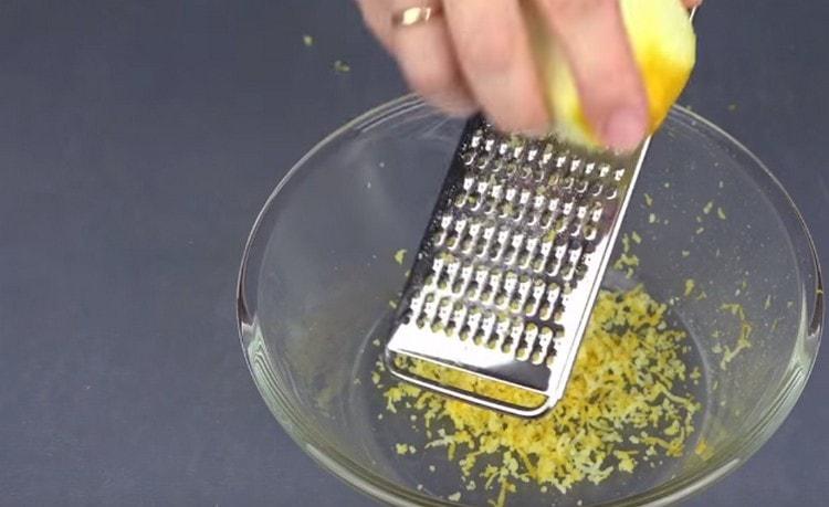 Rub the lemon zest on a grater.