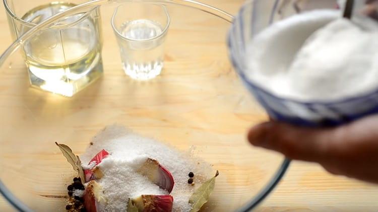 Add spices and sugar and salt to the onions in a deep saucepan or bowl.