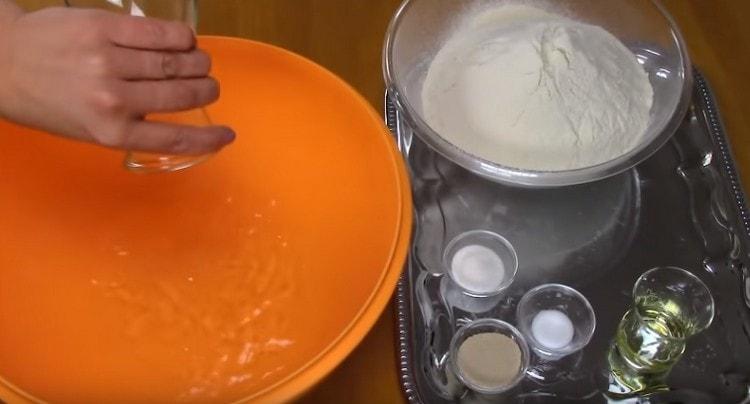 Pour warm water into a bowl.