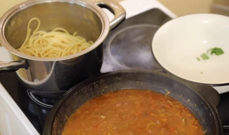 While stewing meat, boil spaghetti.