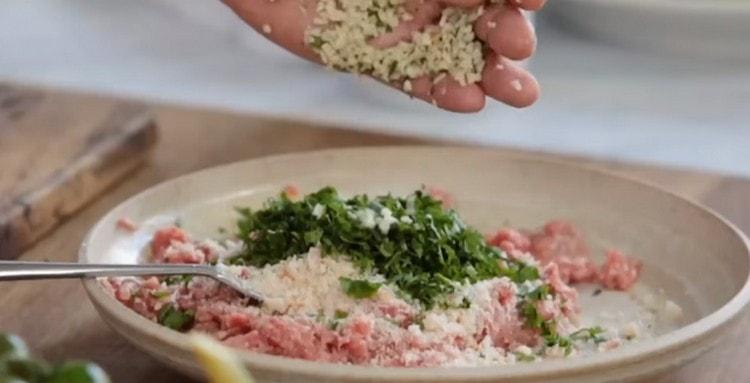 Then add chopped garlic and herbs.